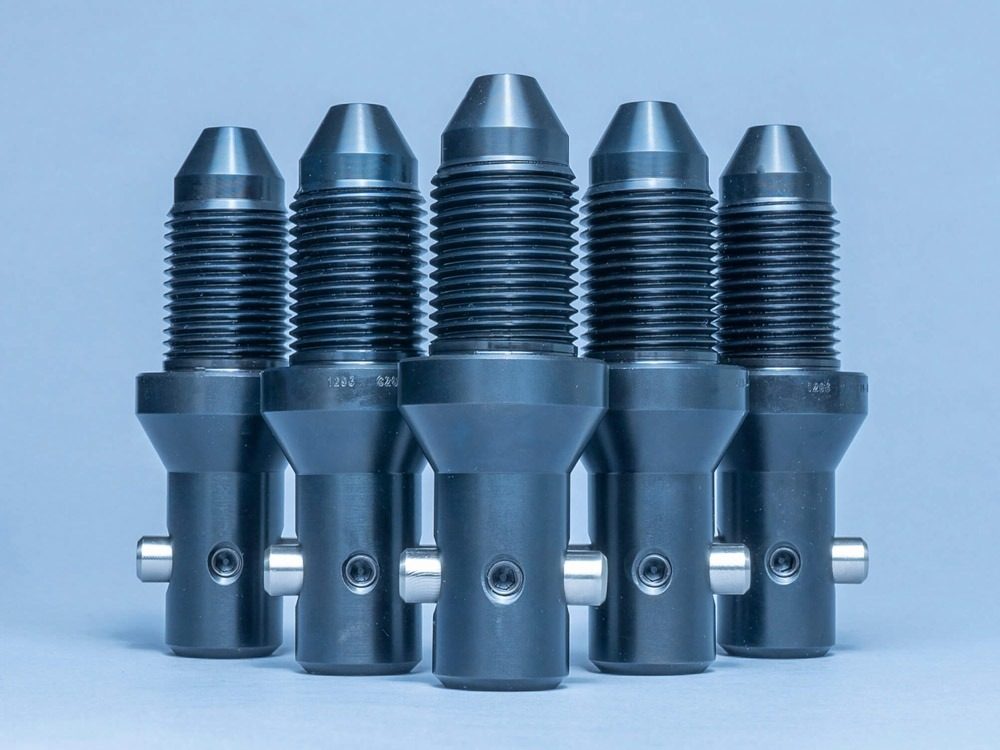 CAMTOP Type H BPV retrieving tool production run — machined steel stinger retrieval tools arranged on workshop bench
